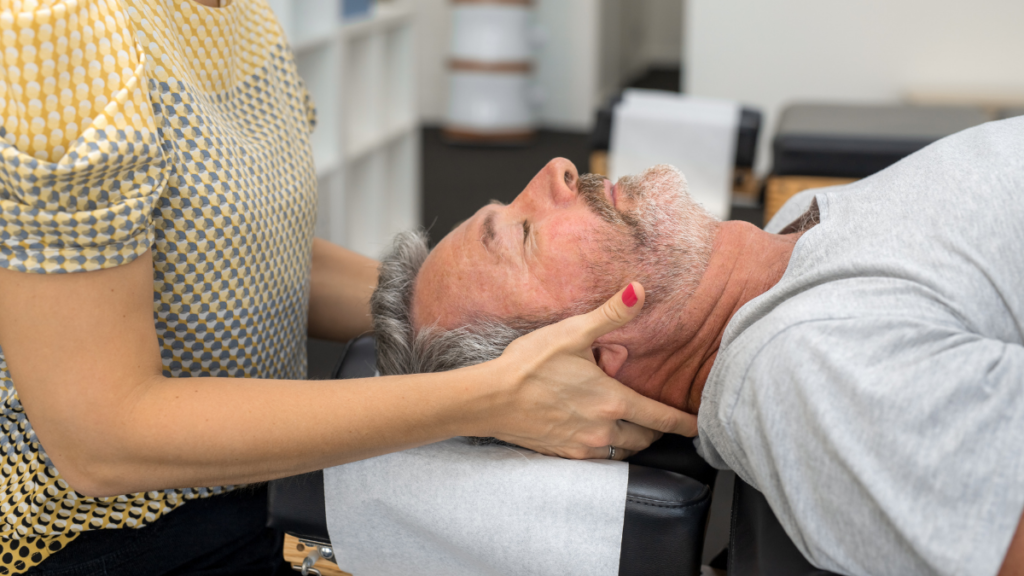 An osteopathic practitioner providing osteopathy support to a male patient