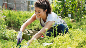 A woman bending over gardening